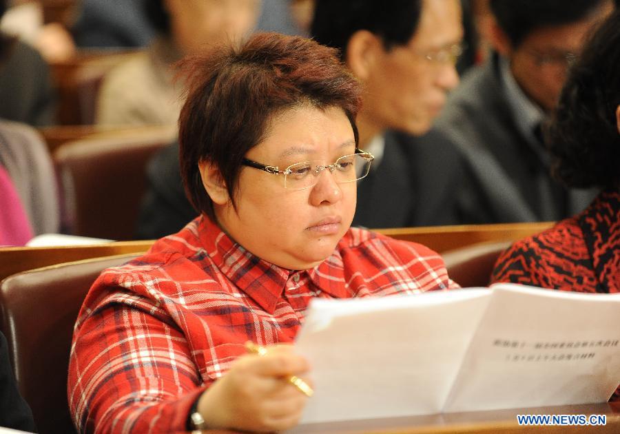 Han Hong, a singer and a member of the 11th National Committee of the Chinese People's Political Consultative Conference (CPPCC), attends the second plenary meeting of the Fifth Session of the 11th CPPCC National Committee at the Great Hall of the People in Beijing, capital of China, March 9, 2012.