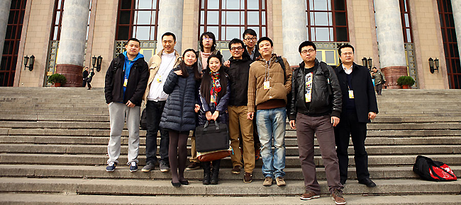 Reporters from China.com.cn taking a group picture in front of the Great Hall of the People after covering the 2nd plenary meeting of 5th session of 11th NPC in Beijing, Mar. 8, 2012.