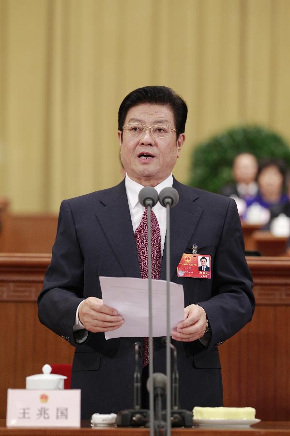 Wang Zhaoguo, vice chairman of the Standing Committee of the National People's Congress (NPC), presides over the third plenary meeting of the Fifth Session of the 11th NPC at the Great Hall of the People in Beijing, capital of China, March 9, 2012.