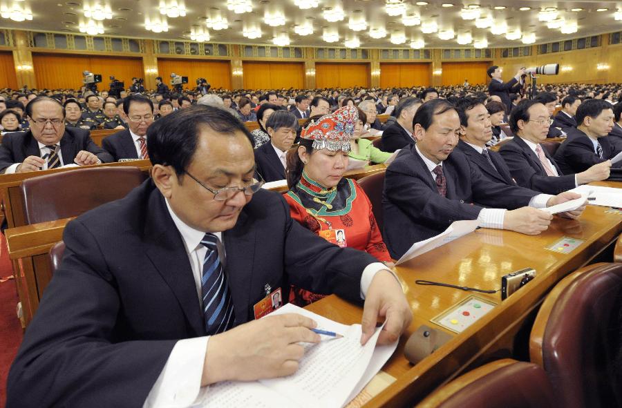 Deputies attend the third plenary meeting of the Fifth Session of the 11th National People's Congress (NPC) at the Great Hall of the People in Beijing, capital of China, March 9, 2012.