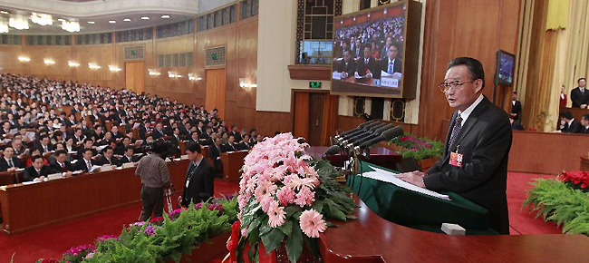 Wu Bangguo, chairman of the Standing Committee of the National People's Congress (NPC), delivers a work report of the Standing Committee of the NPC during the third plenary meeting of the Fifth Session of the 11th NPC at the Great Hall of the People in Beijing, capital of China, March 9, 2012.