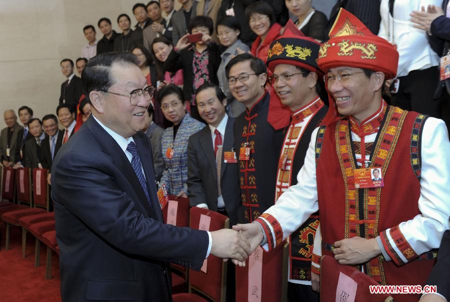 Li Changchun (L, front), member of the Standing Committee of the Political Bureau of the Communist Party of China (CPC) Central Committee, visits deputies to the Fifth Session of the 11th National People's Congress (NPC) from south China's Hainan Province and joins their panel discussion in Beijing, capital of China, March 9, 2012.