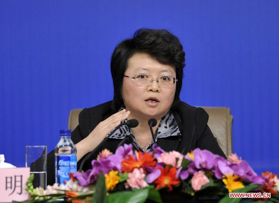 Wu Ming, a member of the 11th National Committee of the Chinese People's Political Consultative Conference (CPPCC) answers questions from journalists during a news conference of the Fifth Session of the 11th CPPCC National Committee on the reform of medical, health care services in Beijing, capital of China, March 10, 2012.