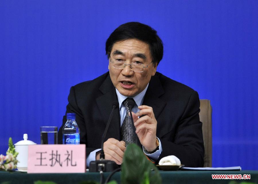 Wang Zhili, a member of the 11th National Committee of the Chinese People's Political Consultative Conference (CPPCC) answers questions from journalists during a news conference of the Fifth Session of the 11th CPPCC National Committee on the reform of medical, health care services in Beijing, capital of China, March 10, 2012.