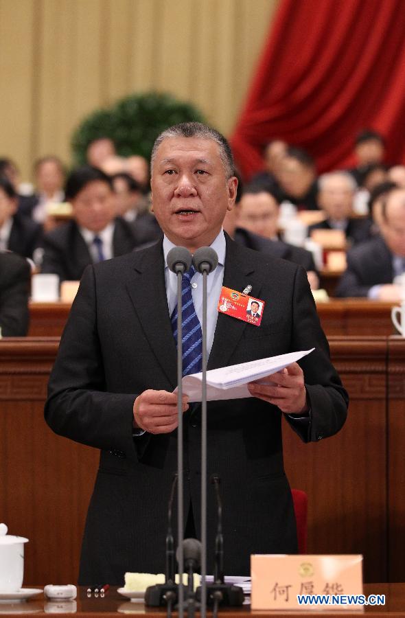 Ho Hau Wah, vice chairman of the National Committee of the Chinese People's Political Consultative Conference (CPPCC), presides over the third plenary meeting of the Fifth Session of the 11th CPPCC National Committee at the Great Hall of the People in Beijing, capital of China, March 10, 2012.