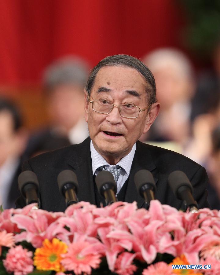 Li Yining, a member of the 11th National Committee of the Chinese People&apos;s Political Consultative Conference (CPPCC) speaks during the third plenary meeting of the Fifth Session of the 11th CPPCC National Committee at the Great Hall of the People in Beijing, capital of China, March 10, 2012.