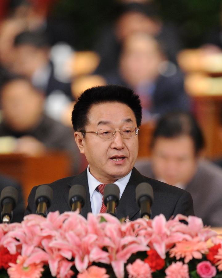 Zhang Mingqi, a member of the 11th National Committee of the Chinese People's Political Consultative Conference (CPPCC), speaks during the fourth plenary meeting of the Fifth Session of the 11th CPPCC National Committee at the Great Hall of the People in Beijing, capital of China, March 11, 2012.