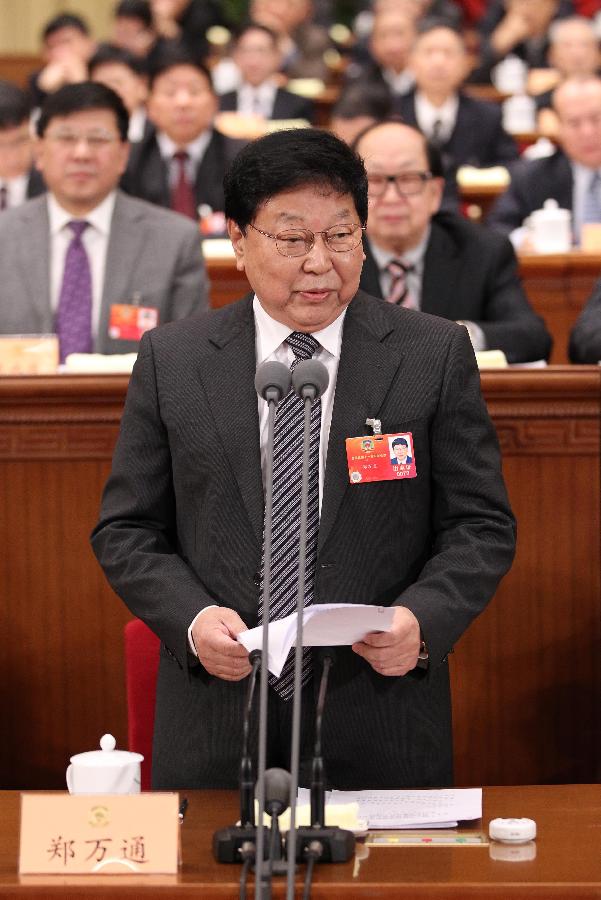 Zheng Wantong, vice chairman of the National Committee of the Chinese People's Political Consultative Conference (CPPCC), presides over the fourth plenary meeting of the Fifth Session of the 11th CPPCC National Committee at the Great Hall of the People in Beijing, capital of China, March 11, 2012.