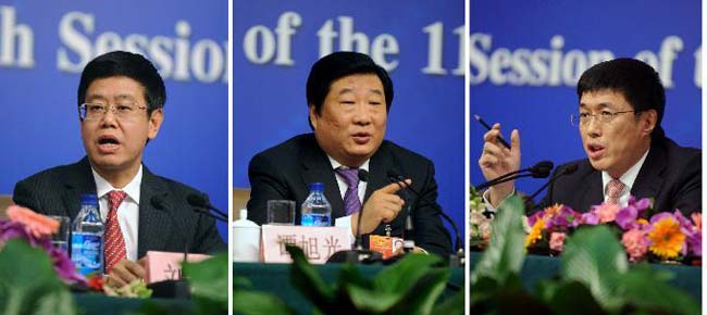 This combined photo taken on March 12, 2012 shows deputies to the Fifth Session of the 11th National People's Congress (NPC) Liu Mingzhong, Tan Xuguang and Yang Tianfu (from left to right) reacting during a press conference on promoting real economy in Beijing, capital of China.