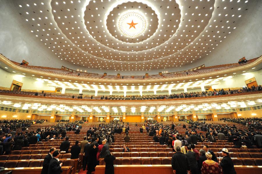 Members of the 11th National Committee of the Chinese People's Political Consultative Conference (CPPCC) leave the conference hall in the Great Hall of the People after the closing meeting of the Fifth Session of the 11th CPPCC National Committee in Beijing, capital of China, March 13, 2012.