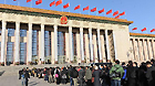 Journalists wait in queues to enter the Great Hall of the People in Beijing, capital of China, March 14, 2012.