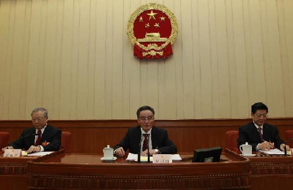Wu Bangguo (C), chairman of the Standing Committee of the National People's Congress (NPC), presides over the fourth meeting of the presidium of the Fifth Session of the 11th NPC at the Great Hall of the People in Beijing, capital of China, March 14, 2012.