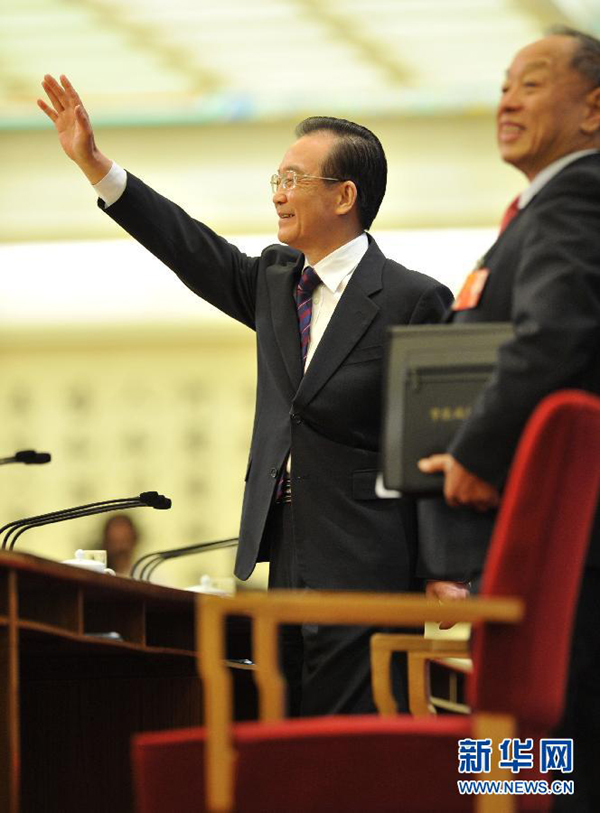 Chinese Premier Wen Jiabao meets the press after the closing meeting of the Fifth Session of the 11th National People&apos;s Congress (NPC) at the Great Hall of the People in Beijing, March 14, 2011.