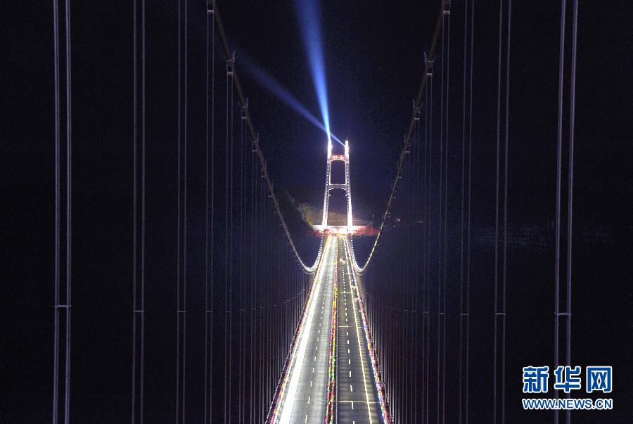 Workers complete final lighting tests in readiness for the opening of the Aizhai Extra--large Suspension Bridge in Aizhai Town of Jishou City, central China&apos;s Hunan Province, on Mar. 31, 2012.