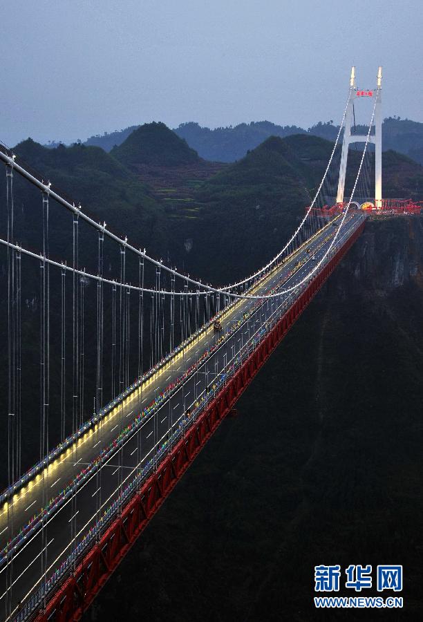 Workers complete final lighting tests in readiness for the opening of the Aizhai Extra--large Suspension Bridge in Aizhai Town of Jishou City, central China&apos;s Hunan Province, on Mar. 31, 2012.