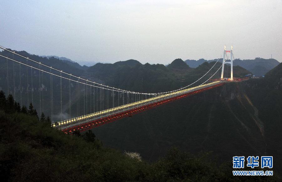 Workers complete final lighting tests in readiness for the opening of the Aizhai Extra--large Suspension Bridge in Aizhai Town of Jishou City, central China&apos;s Hunan Province, on Mar. 31, 2012.