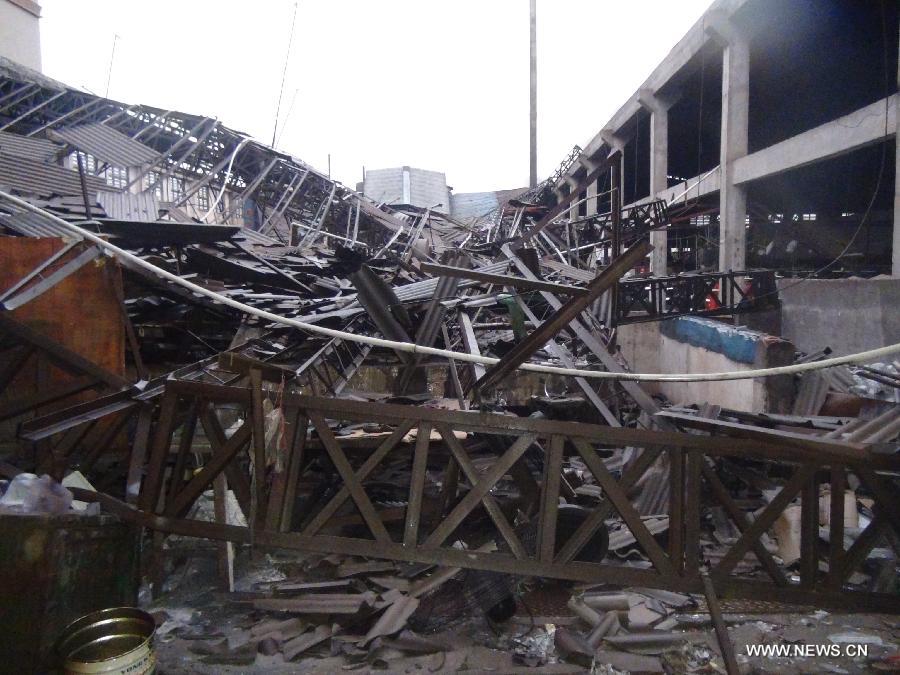 A glass factory is damaged by a tornado in Jiangmen, south China's Guangdong Province, May 4, 2012.