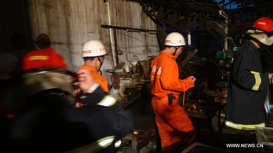 Rescuers search for trapped people at a glass factory damaged by a tornado in Jiangmen, south China's Guangdong Province, May 4, 2012. 