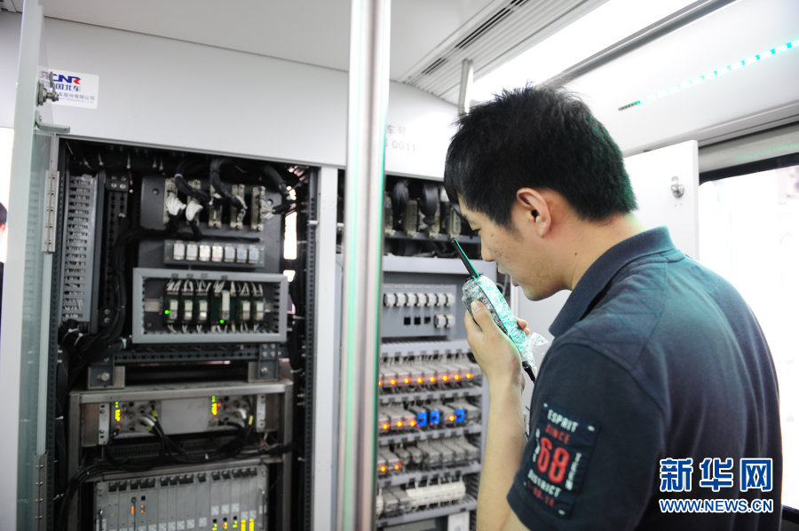 Technicians test communication equipment for subway line 6 (Phrase 1) which will open this September in Beijing, May 9, 2012. 