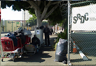 People are living on Skid Row, the place in the shadows of the high rises of the corporate jungle of downtown Los Angeles.
