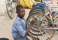 The African children often drop out of school because of poverty, looking for job to feed their family.