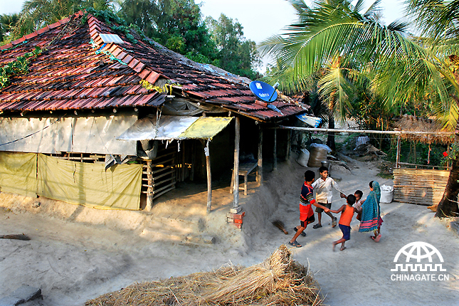 Children are playing in a village which is 150km from Kolkata in one of small islands of Sundarbon. Farming and fishing is the occupation of the villagers. There were no electrifications in this island earlier, but recent years every family is using a solar panel and dish antenna by the help of the government.