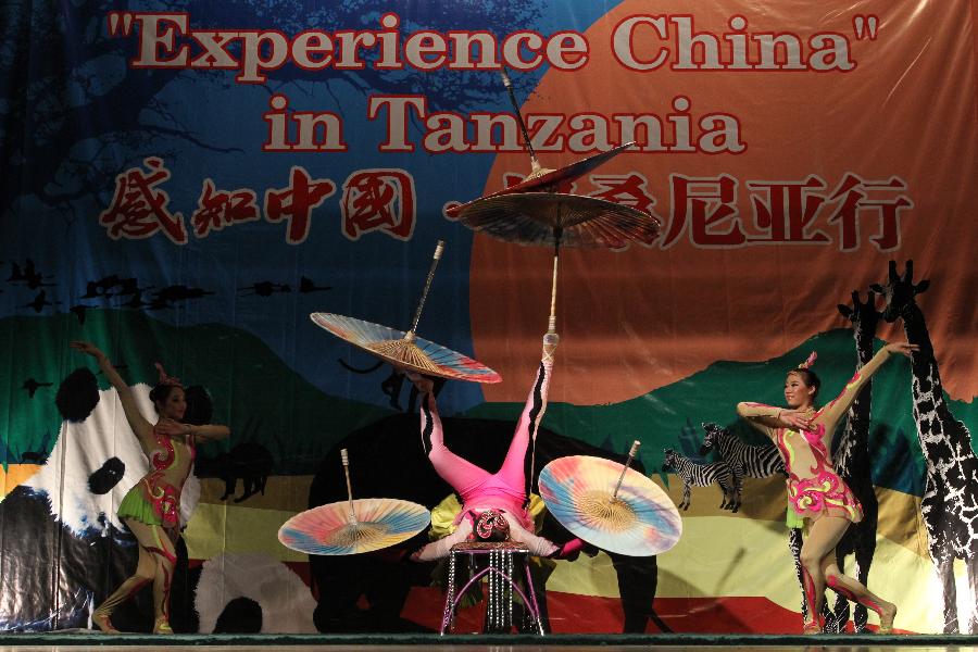 Chinese acrobats perform Umbrella Juggling during the show 'Experience China' in Dar es Salaam, Tanzania, Sept. 24, 2012. 