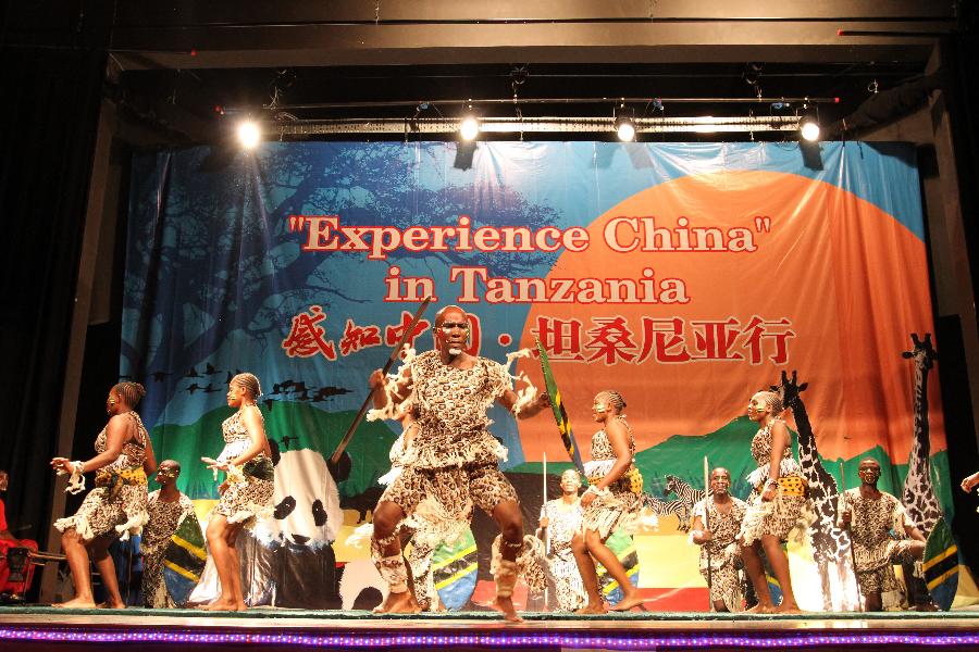 Tanzanian artists perform local dancing during the show 'Experience China' in Dar es Salaam, Tanzania, Sept. 24, 2012.