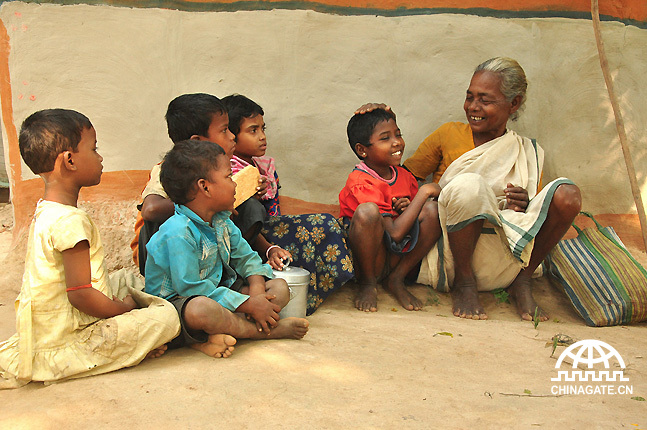 A rural grandmother is telling a story to the next generation.