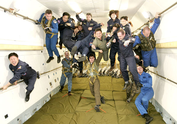 Chinese tourists experience zero gravity in a space navigation center in Moscow, Russia, Dec 17, 2004 file photo.