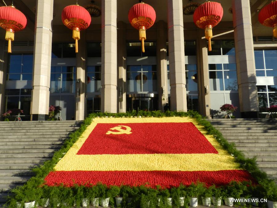 Flower decorations are seen to greet the upcoming 18th National Congress of the Communist Party of China (CPC) in Beijing, capital of China, Oct. 30, 2012.