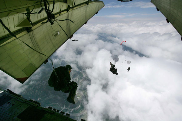 Solders jump to rescue above Maoxian County, Sichuan Province, after the 8.0-magnitude earthquake on May 14, 2008. 