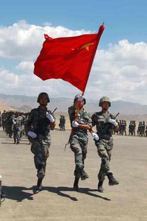 Chinese soldiers participate in Peace Mission 2012, an anti-terror drill in the 'Chorukh-Dayron' shooting range, in Khujand city of Tajikistan on June 14, 2012.