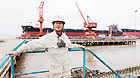 Hong Gang poses for photos at Shanghai Waigaoqiao Shipbuilding Co, Ltd in Shanghai on Sept 14, 2012.