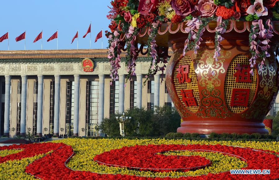 Photo taken on Nov. 8, 2012 shows a flower parterre at the Tian'anmen Square, with the Great Hall of the People in the background, in Beijing, capital of China. 