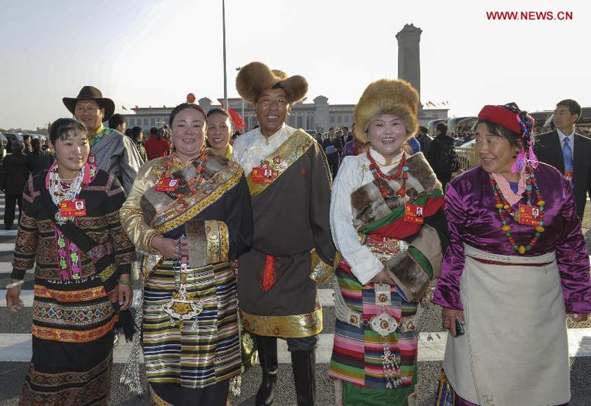 Delegates of the 18th National Congress of the Communist Party of China (CPC) arrive to attend the 18th CPC National Congress at the Great Hall of the People in Beijing, capital of China, Nov. 8, 2012. 