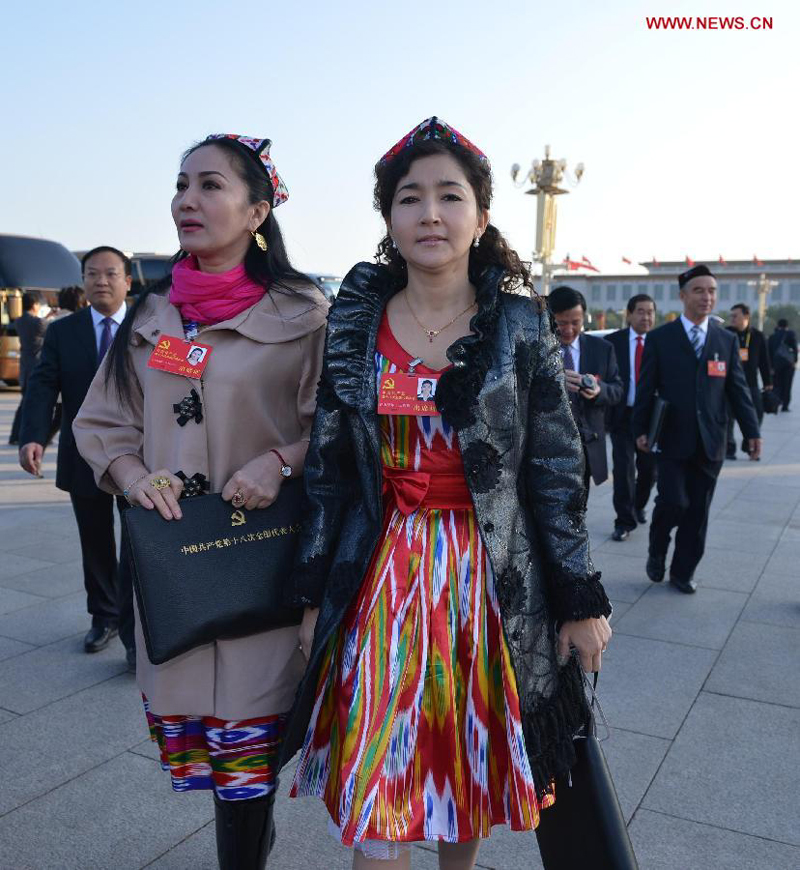 Delegates of the 18th National Congress of the Communist Party of China (CPC) arrive to attend the 18th CPC National Congress at the Great Hall of the People in Beijing, capital of China, Nov. 8, 2012. 