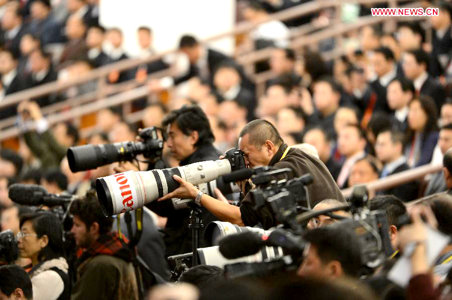 Photographers take photos at the opening ceremony of the 18th National Congress of the Communist Party of China (CPC) at the Great Hall of the People in Beijing, capital of China, Nov. 8, 2012.