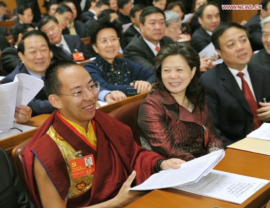 The 11th Panchen Lama, Bainqen Erdini Qoigyijabu (L), attends, as a nonvoting delegate, the opening ceremony of the 18th National Congress of the Communist Party of China (CPC) at the Great Hall of the People in Beijing, capital of China, on Nov. 8, 2012.