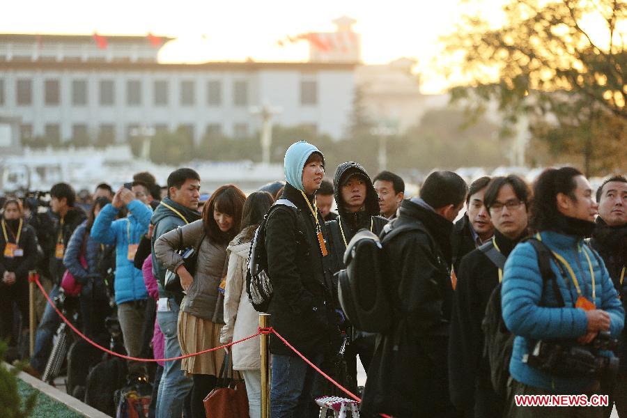 Journalists wait outside the Great Hall of the People, the venue of the opening ceremony of the 18th National Congress of the Communist Party of China (CPC), at the Tian'anmen Square in Beijing, capital of China, Nov. 8, 2012.