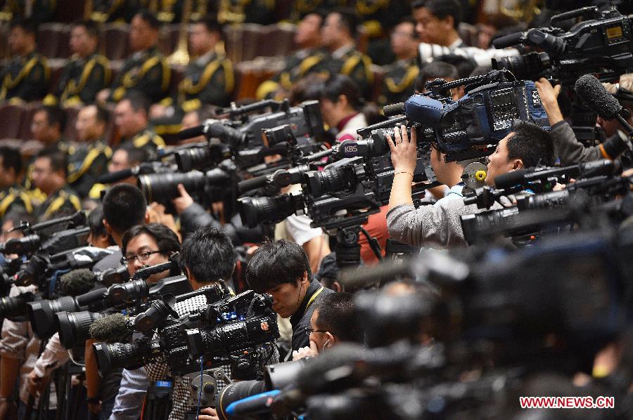 Video journalists cover the opening ceremony of the 18th National Congress of the Communist Party of China (CPC) at the Great Hall of the People in Beijing, capital of China, Nov. 8, 2012. 