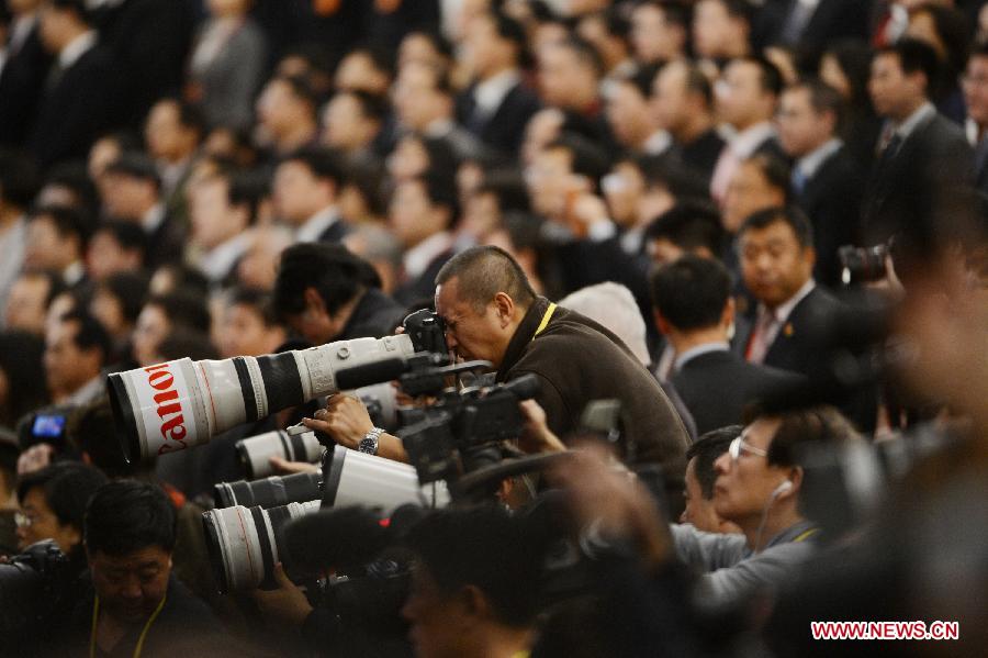 Photographers take photos of the opening ceremony of the 18th National Congress of the Communist Party of China (CPC) at the Great Hall of the People in Beijing, capital of China, Nov. 8, 2012. 