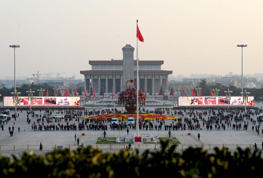 A pair of large screens display achievements which China has gained under the leadership of the Communist Party of China (CPC) in the past decade, at the Tian'anmen Square in central Beijing, capital of China, Nov. 8, 2012. 