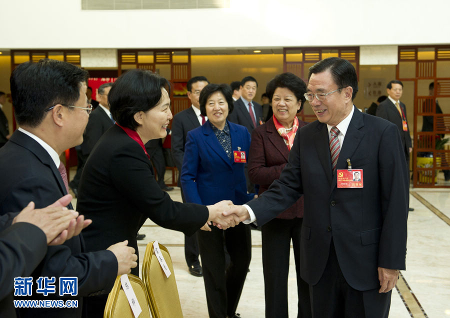 He Guoqiang (R, front) joins a panel discussion of Fujian delegation to the 18th National Congress of the Communist Party of China (CPC) in Beijing, capital of China, Nov. 8, 2012.