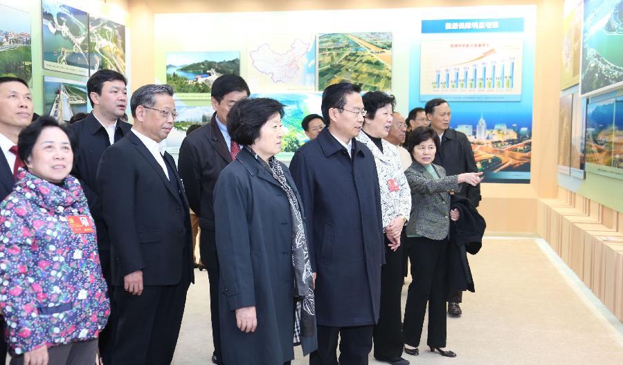 Delegates to the 18th National Congress of the Communist Party of China (CPC) visit a photo exhibition on achievements which China has gained under the leadership of the CPC, at Beijing Exhibition Center in Beijing, capital of China, Nov. 9, 2012.