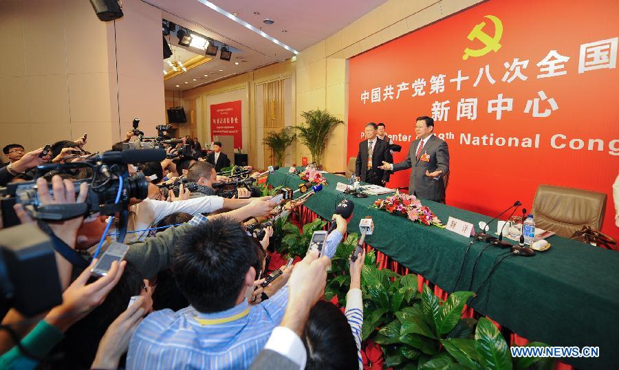 Chinese Minister of Commerce Chen Deming (R) receives interview at the press center of the 18th National Congress of the Communist Party of China (CPC) in Beijing, capital of China, Nov. 10, 2012.