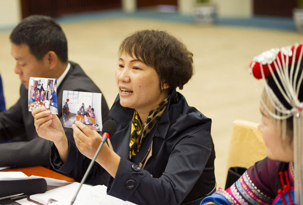 The delegate from Zhejiang province and a teacher from Dachen Island, Weng Lifen makes a speech about education equality in Beijing on Nov 10, 2012.