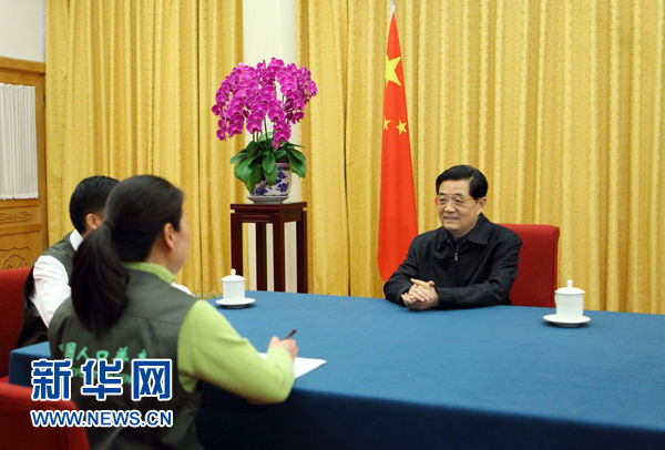 Chinese President Hu Jintao answers questions from the census-takers during the sixth nationwide population census in Beijing on Nov. 2, 2010.