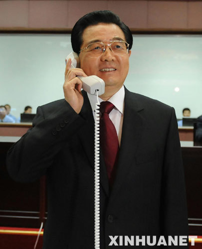 Chinese President Hu Jintao talks via phone with astronauts on the spacecraft Shenzhou-7 from the Beijing Aerospace Control Center (BACC) on Sep. 27, 2008. 