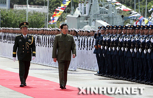 Hu Jintao (front R), general secretary of the CPC Central Committee, Chinese president and chairman of the Central Military Commission, reviews troops of the Chinese People's Liberation Army (PLA) Garrison in Hong Kong SAR on Jun. 30, 2007.